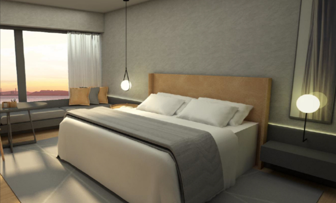 Quarto com cama king-size e área de estar